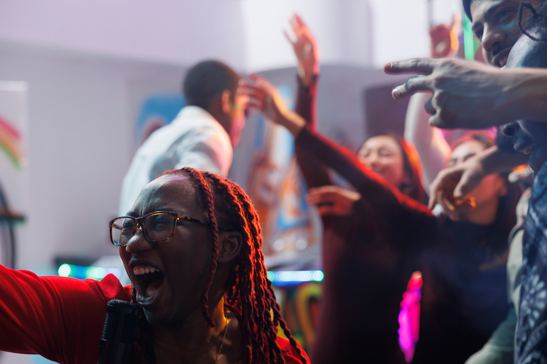 Woman singing in microphone in club